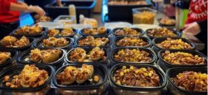 Clean Eatz team preparing healthy, macro-friendly meals for customers