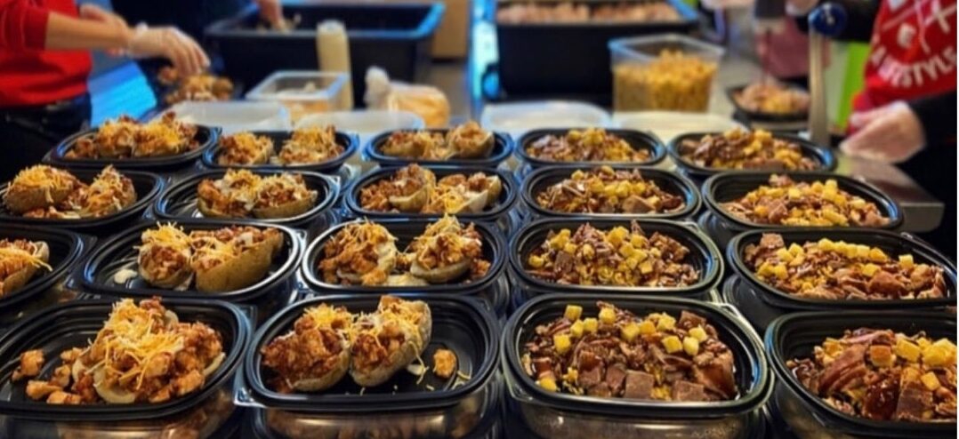 Clean Eatz team preparing healthy, macro-friendly meals for customers