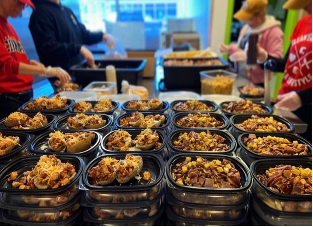 Clean Eatz team preparing healthy, macro-friendly meals for customers