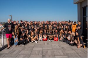 Group photo of Clean team members gathered outdoors at a Clean Eatz event.