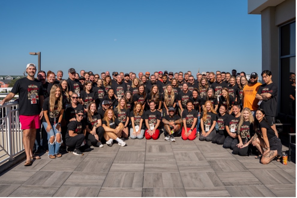Group photo of Clean team members gathered outdoors at a Clean Eatz event.